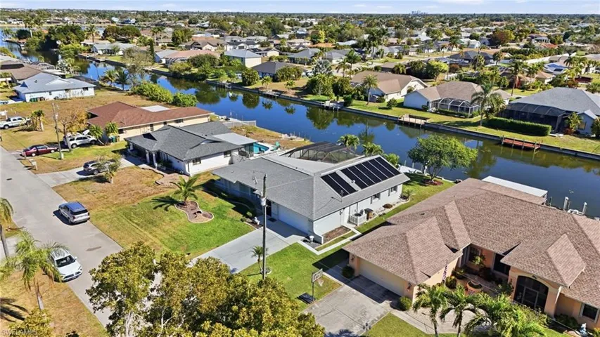 Aerial perspective of suburban area with a nearby body of water
