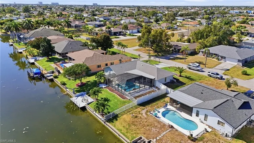 View of property location with nearby suburban area and a large body of water