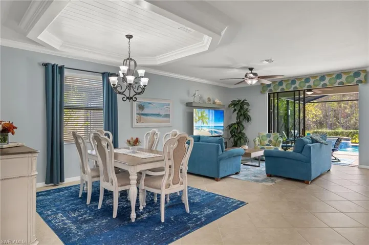 Dining room featuring crown molding and shiplap tray ceiling