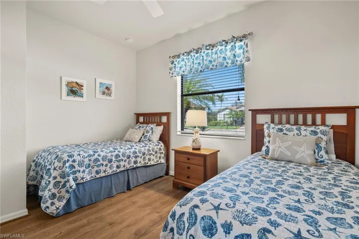 Bedroom with hardwood / wood-style flooring and ceiling fan