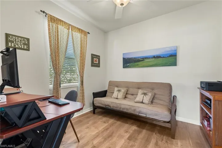 Office area featuring hardwood / wood-style flooring and ceiling fan