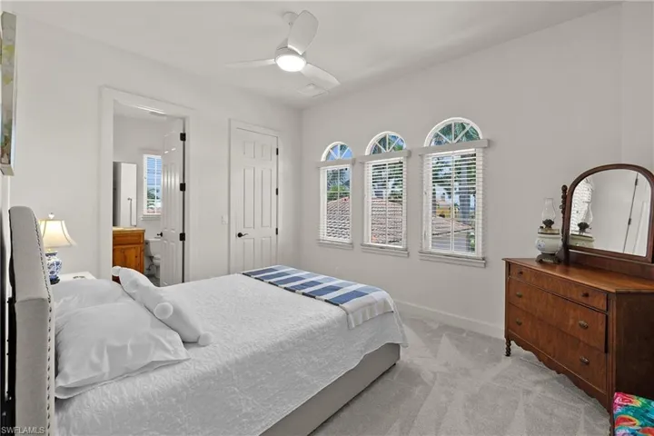 Bedroom featuring carpet and ceiling fan