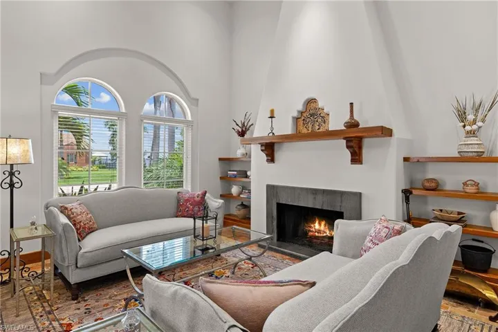 Living room featuring a high ceiling and Brazilian Cherry flooring