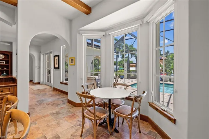 Tiled breakfast nook with beam ceiling