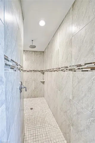 Bathroom with tiled shower
