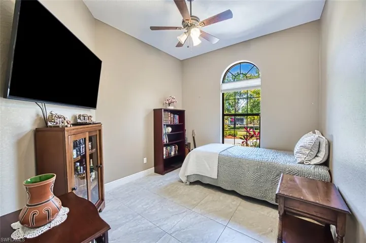 Bedroom featuring baseboards and a ceiling fan