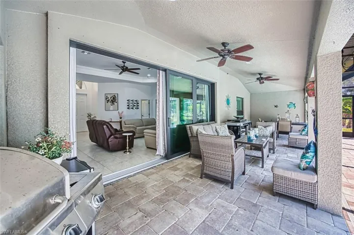 View of patio / terrace with ceiling fan and an outdoor hangout area