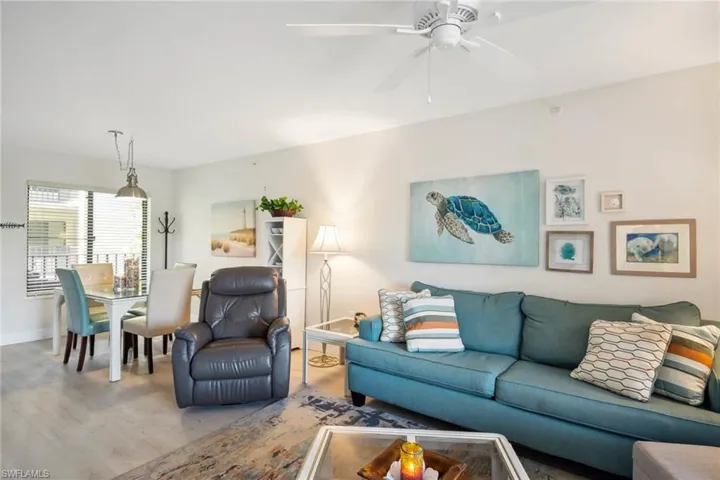 Living room featuring wood finished floors and a ceiling fan