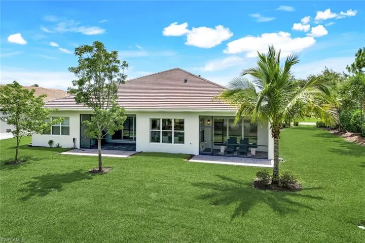 Back of home with large Side Yard