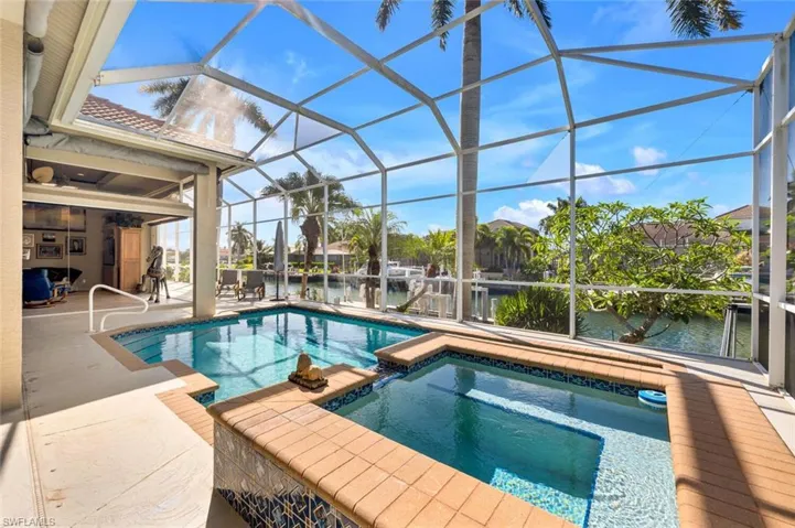 Lanai pool/spa overlooking the canal and boat dock