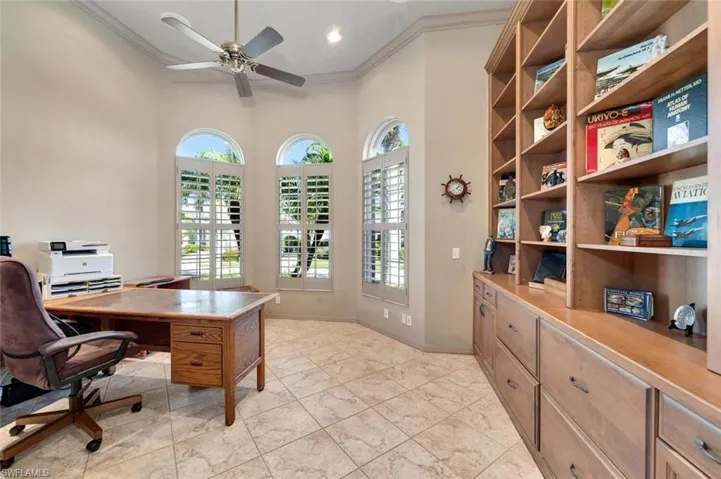Office space with custom bookshelves and sitting area
