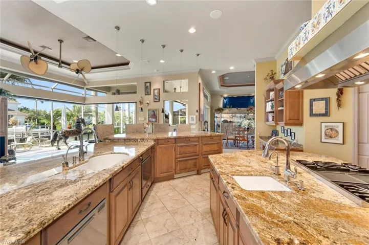 Integrated kitchen/living/dining area space open to lanai/pool
