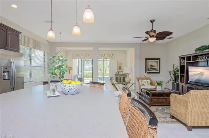 Living room with plenty of natural light and ceiling fan