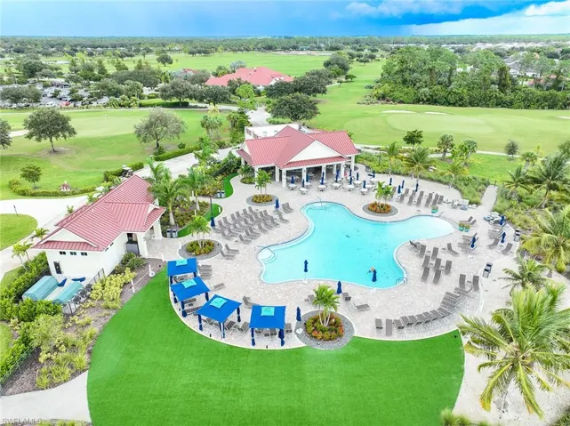 Pool featuring view of golf course, a patio, and a gazebo