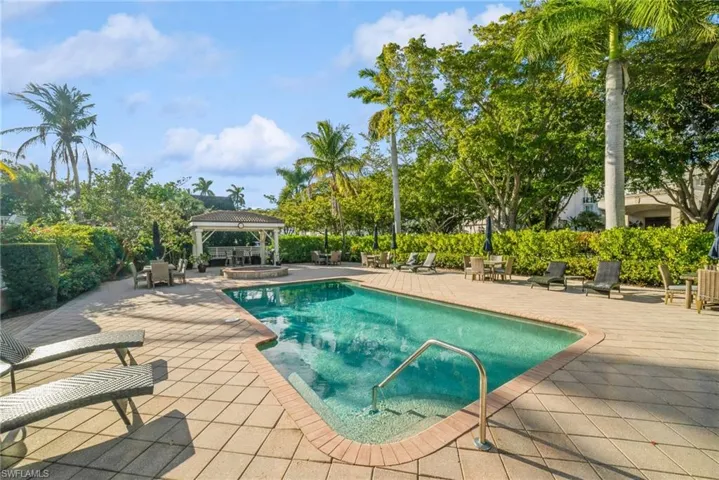 View of pool featuring a gazebo, a patio area, and an in-ground hot tub