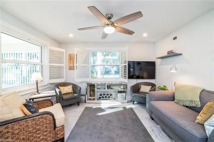 Living area featuring ceiling fan
