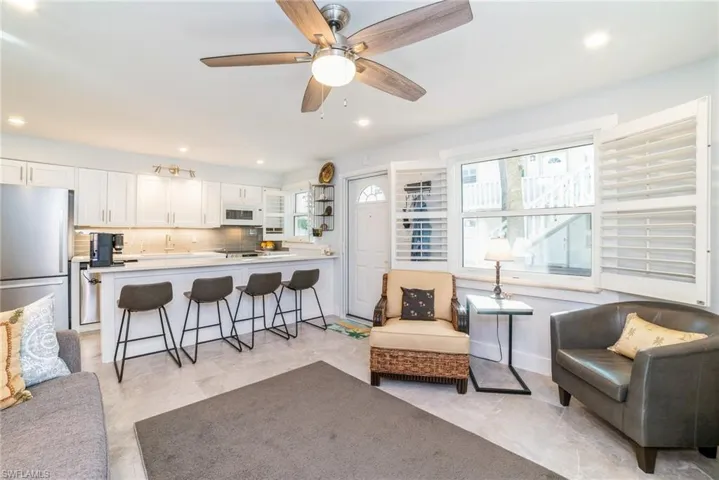 Living area with ceiling fan and recessed lighting