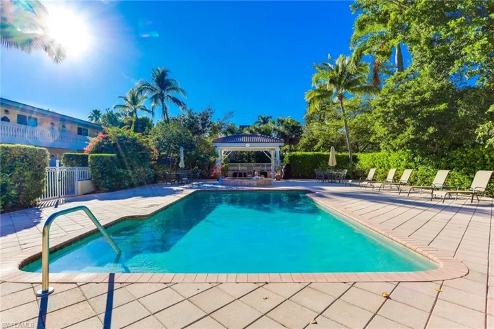 Swimming pool featuring a patio and a gazebo
