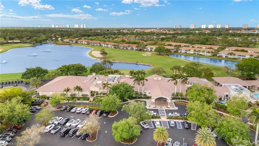 Birds eye view of community featuring Spring Run Golf and Country Club and western skyline of beach and bay front high-rises.