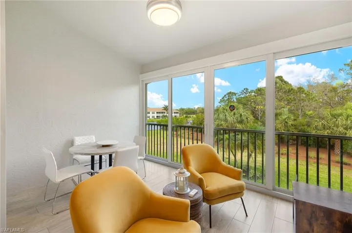 Sunroom with partial water and preserve views.