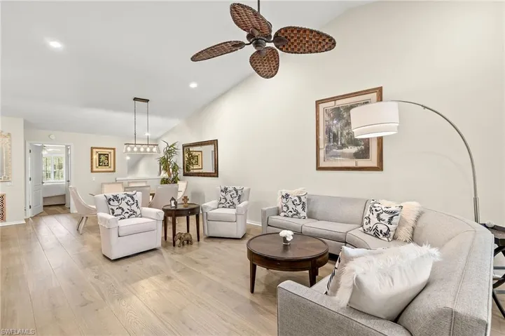 Lofted ceiling light wood flooring.