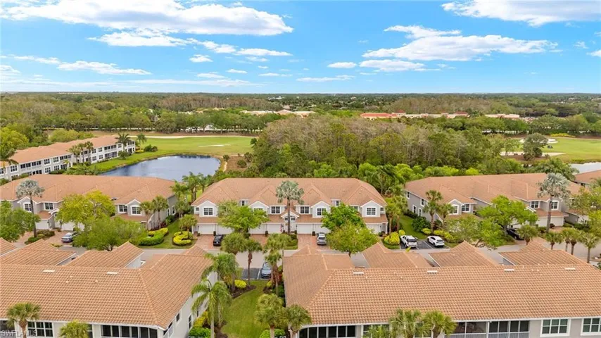 Drone / aerial view featuring a residential view, a water view, and view of golf course