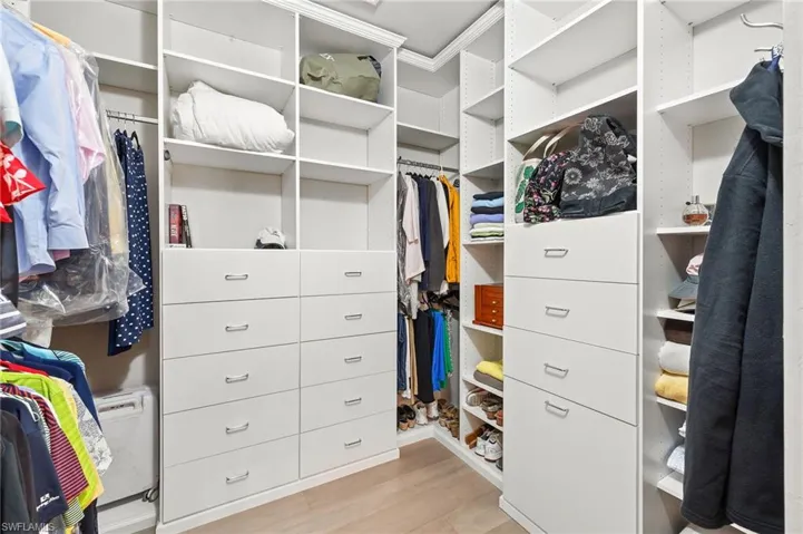 Primary bedroom custom closet.