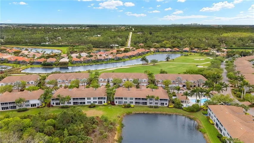 Aerial view featuring a residential view, a water view, and view of golf course