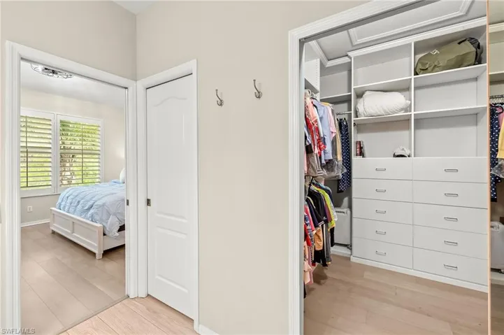 Primary bedroom custom closet.