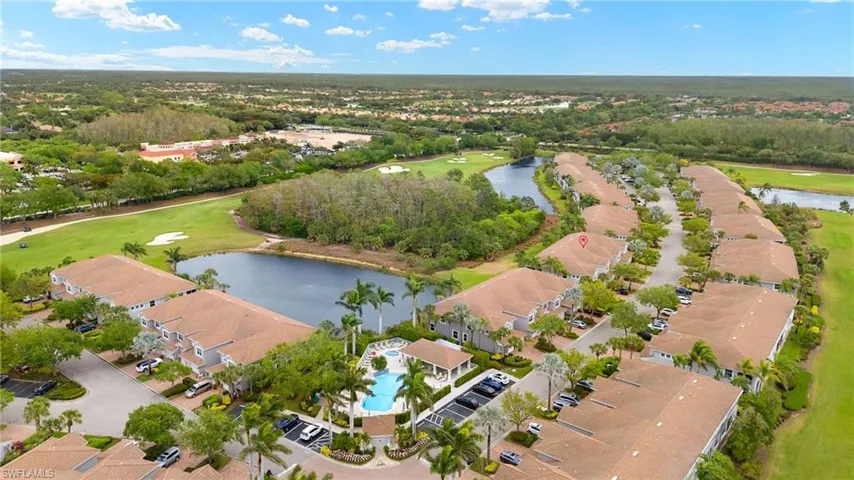 Bird's eye view featuring a residential view, golf course view, and a water view