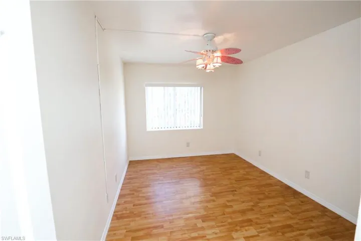 Spare room featuring light wood-style flooring and a ceiling fan