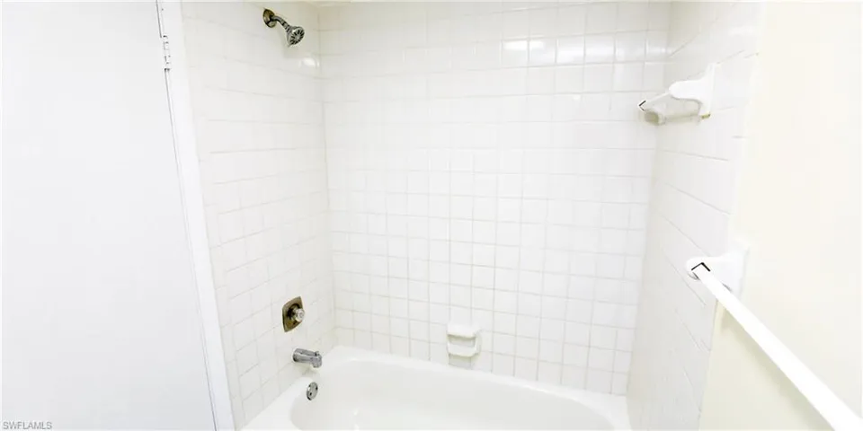 Full bathroom with shower / washtub combination