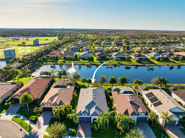 Aerial perspective of suburban area with a large body of water
