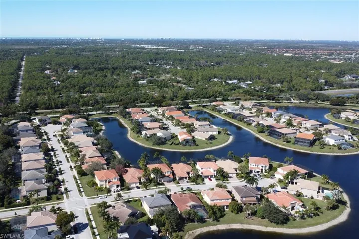 Aerial overview of property's location featuring nearby suburban area and a large body of water