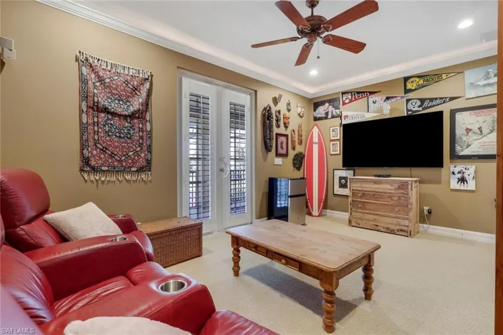 Living room with french doors, carpet, crown molding, recessed lighting, and a ceiling fan