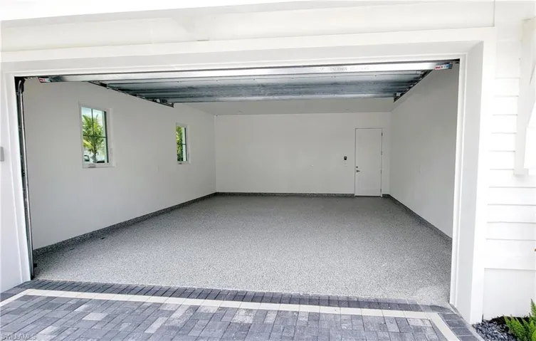 View of two garage with coated floor