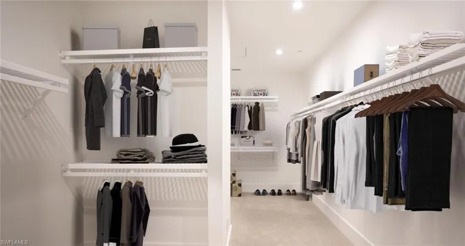 Walk in closet with carpet. Picture has digitally enhanced furniture.