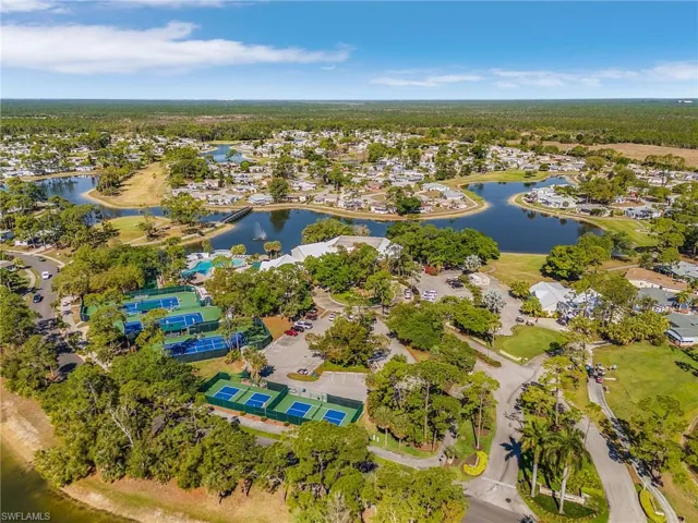 Aerial perspective of suburban area with a nearby body of water