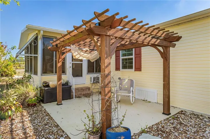 View of patio featuring a sunroom and a pergola
