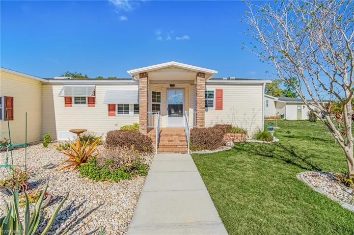 View of front of home with a front yard