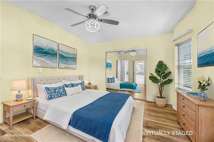 Bedroom featuring light wood-type flooring and ceiling fan
