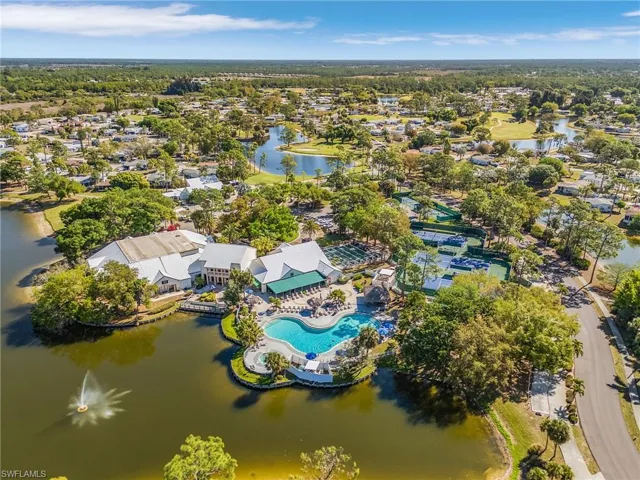 Drone / aerial view of a large body of water and a pool