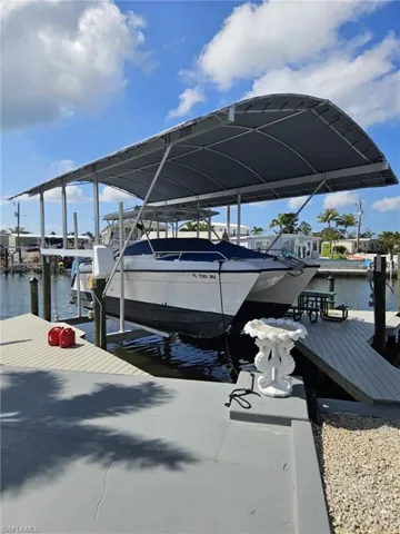 View of dock featuring a water view and boat lift
