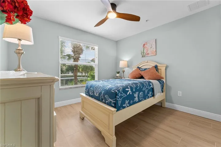Guest bedroom, large enough for a queen bed - showing 1 twin with night stand and dresser. All new tile floors, baseboards, ceiling fan w/light, professionally painted throughout.