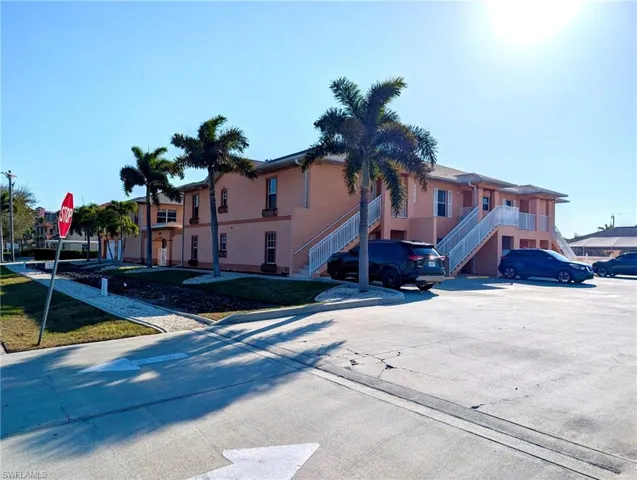 Parking area located right side of buildings.