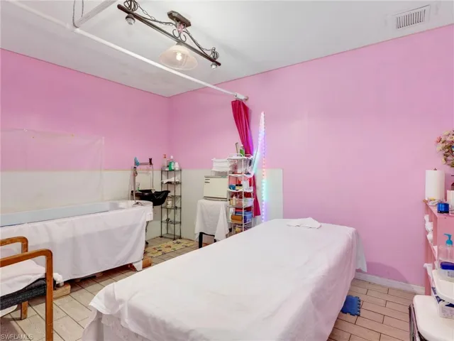 Bedroom featuring wood tiled floors
