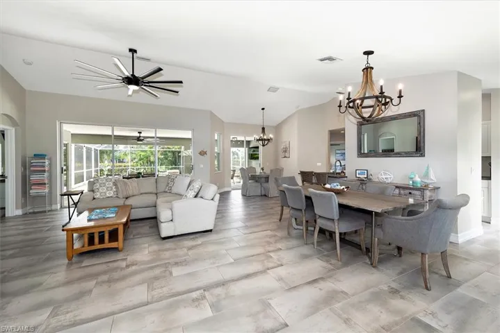 Dining area featuring a chandelier and vaulted ceiling