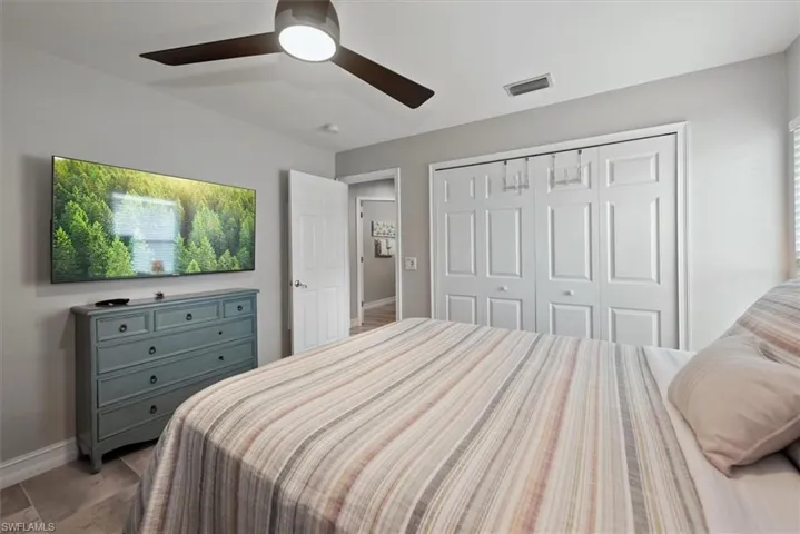 Bedroom with a closet and ceiling fan