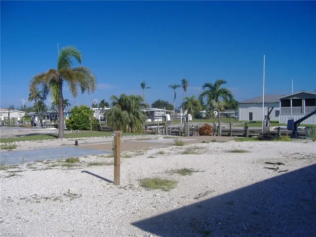 Dock area with boat lift and a water view