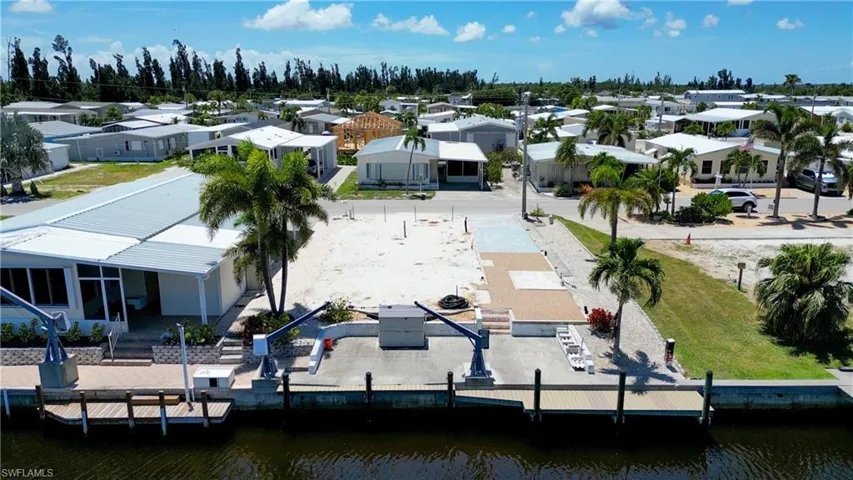 View of property location featuring nearby suburban area and a nearby body of water